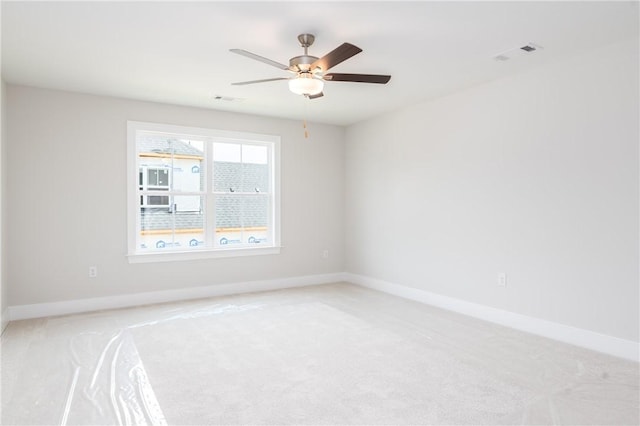 2022 Hidden Lakes Dr, Opelika, AL 36801 - spare room featuring light carpet, a ceiling fan, and baseboards