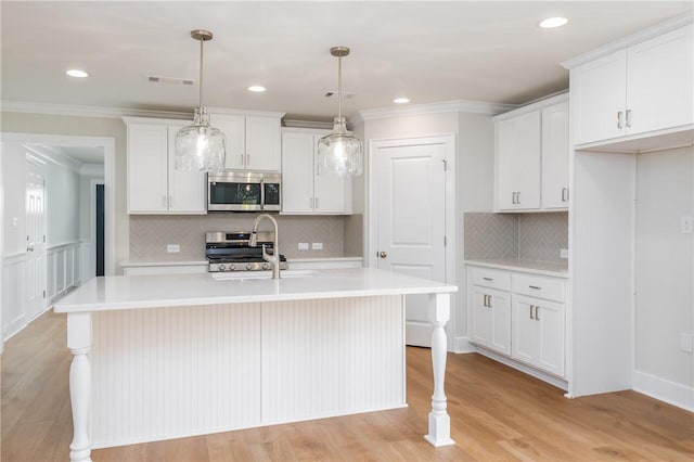 2022 Hidden Lakes Dr, Opelika, AL 36801 - kitchen with stainless steel microwave, range, a sink, light countertops, and crown molding