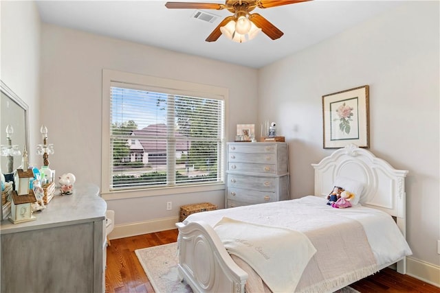 bedroom with hardwood / wood-style floors and ceiling fan