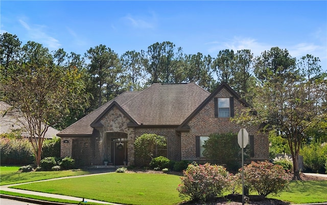 tudor-style house with a front lawn