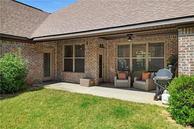 rear view of house with a yard, a patio area, and ceiling fan