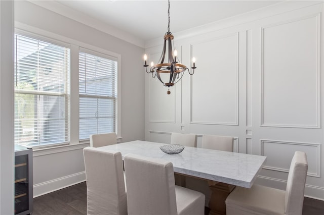 dining space featuring dark hardwood / wood-style floors, an inviting chandelier, plenty of natural light, and crown molding