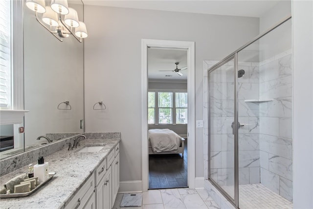 bathroom with vanity, an enclosed shower, ceiling fan with notable chandelier, and crown molding