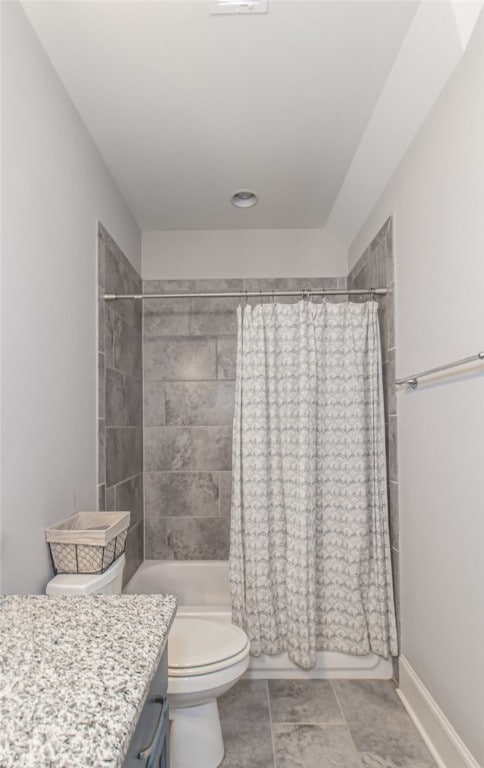 full bathroom with vanity, shower / bath combination with curtain, and toilet