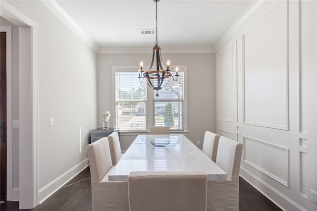 dining space featuring a chandelier and ornamental molding