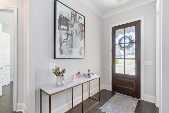 foyer entrance featuring dark wood-type flooring and ornamental molding