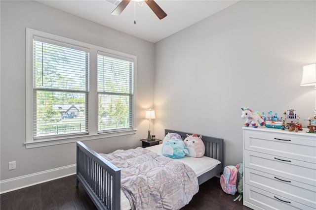 bedroom with ceiling fan and dark wood-type flooring