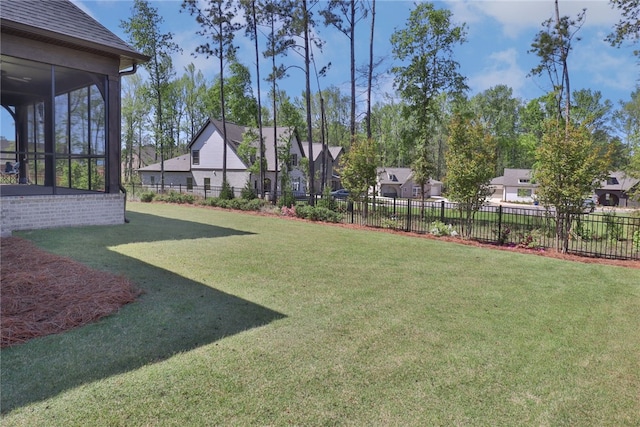 view of yard with a sunroom