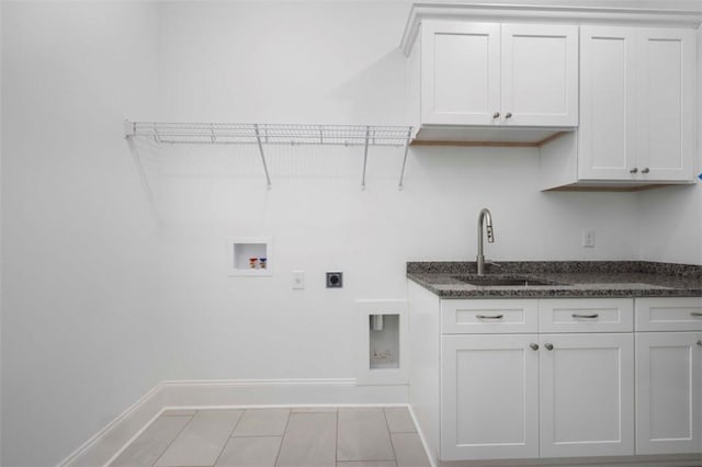 laundry area featuring sink, hookup for an electric dryer, cabinets, and hookup for a washing machine