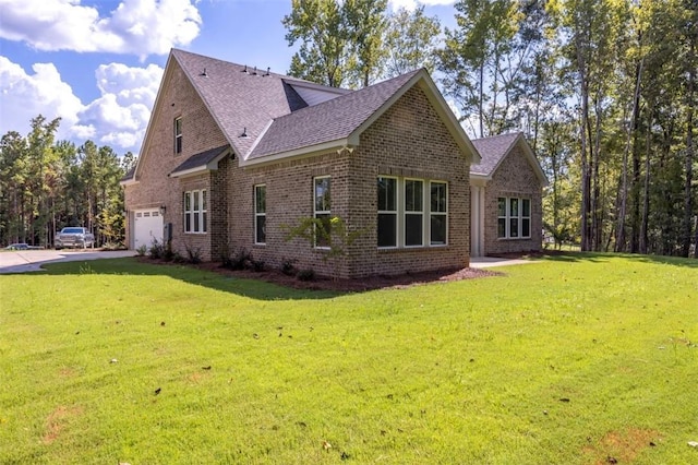 view of property exterior with a garage and a yard