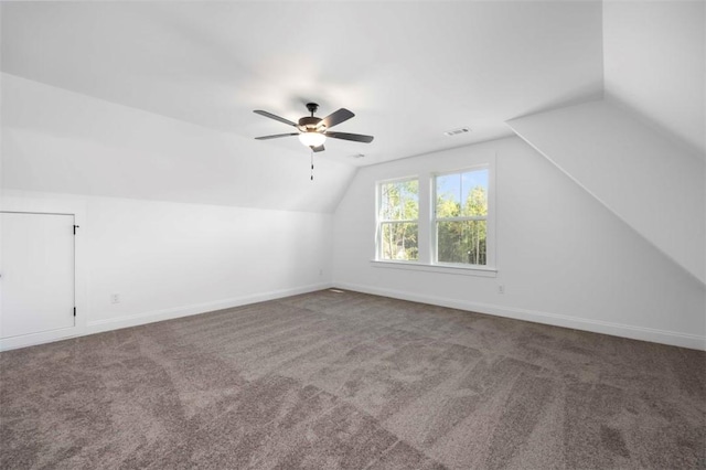 bonus room with carpet flooring, vaulted ceiling, and ceiling fan