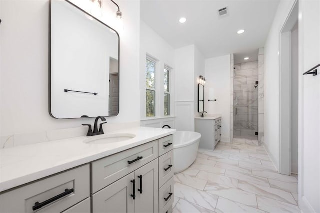 bathroom with independent shower and bath and vanity