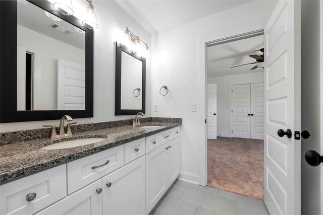 bathroom featuring tile patterned floors, ceiling fan, and vanity