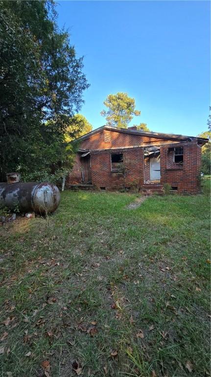 1270 Lee Road 57, Auburn, AL 36832 - rear view of house with a lawn and crawl space