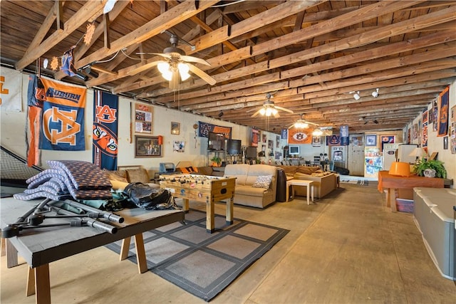 game room with ceiling fan and concrete flooring