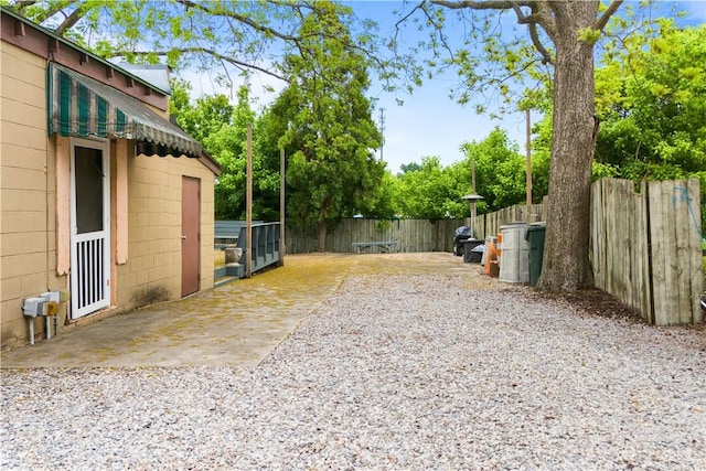 view of yard featuring a fenced backyard and a patio