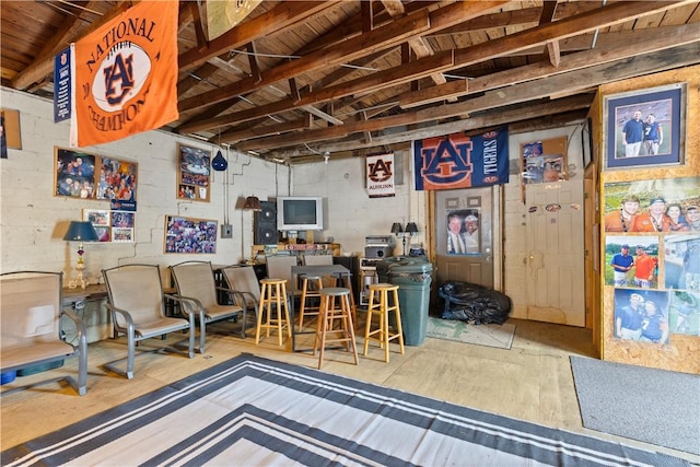 interior space with concrete block wall