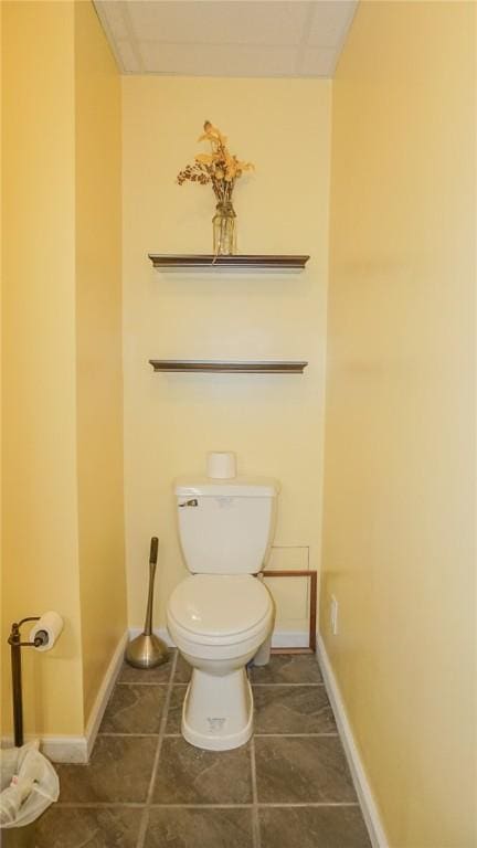 bathroom with tile patterned flooring and toilet