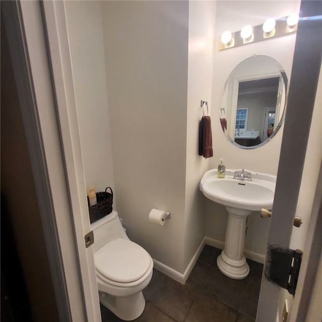 bathroom with tile patterned floors and toilet