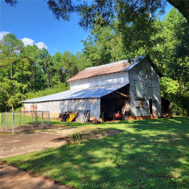 view of outbuilding with a yard