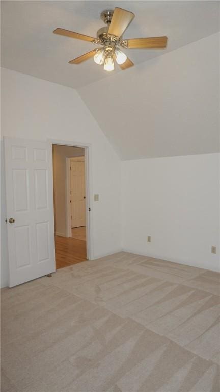 bonus room featuring light carpet, ceiling fan, and lofted ceiling