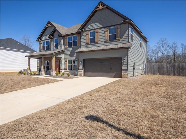 craftsman-style home with covered porch, concrete driveway, a garage, and fence