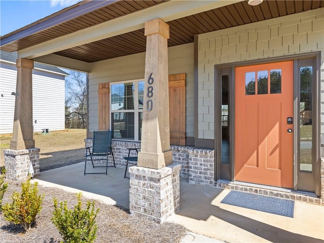 doorway to property featuring a porch