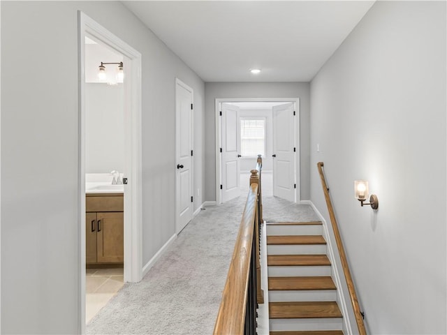 stairway with carpet and baseboards