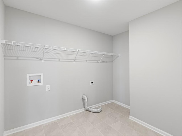 washroom featuring laundry area, hookup for an electric dryer, baseboards, and washer hookup