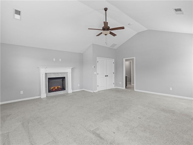 unfurnished living room featuring a ceiling fan, carpet, visible vents, and a premium fireplace