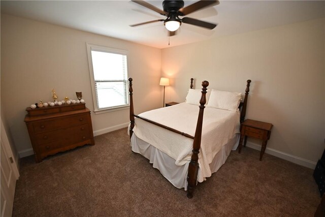 carpeted bedroom with a ceiling fan and baseboards