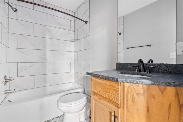 full bathroom featuring vanity, toilet, and tiled shower / bath