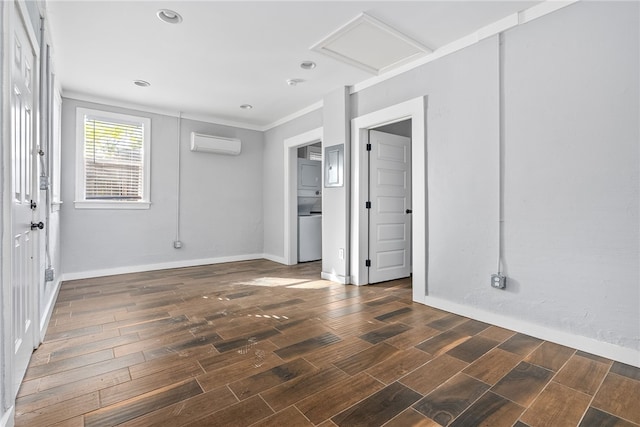 spare room with a wall mounted air conditioner and ornamental molding