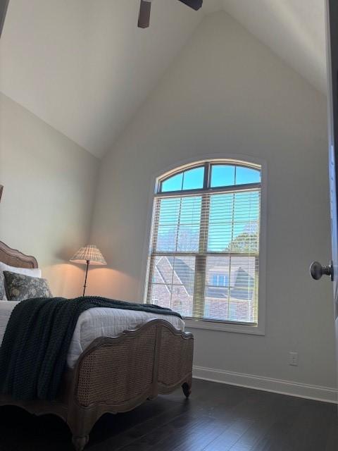 bedroom featuring high vaulted ceiling, ceiling fan, and dark wood-type flooring