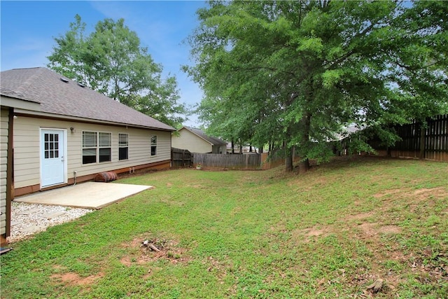 view of yard with a fenced backyard and a patio area