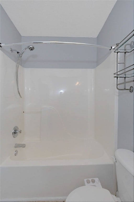 full bath featuring toilet and bathing tub / shower combination
