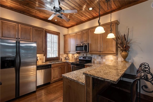 kitchen featuring a breakfast bar, tasteful backsplash, appliances with stainless steel finishes, wooden ceiling, and a peninsula