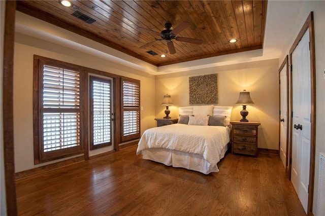 bedroom featuring access to outside, wood finished floors, wooden ceiling, and a raised ceiling