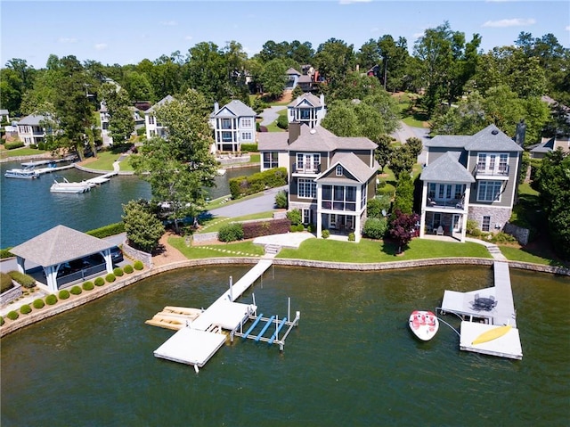 birds eye view of property with a residential view and a water view