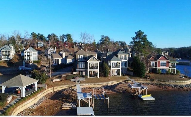 exterior space with a water view and a residential view