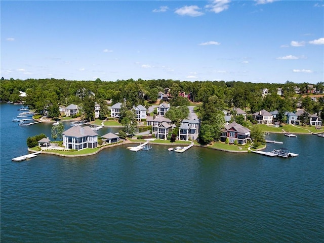 drone / aerial view featuring a residential view and a water view