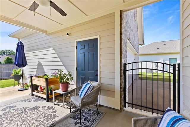 2409 Meadow Cove Rd, Auburn, AL 36832 - property entrance featuring ceiling fan, a gate, and a patio area