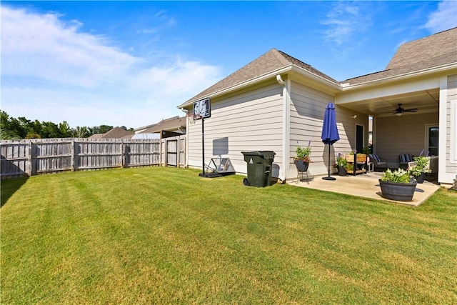 2409 Meadow Cove Rd, Auburn, AL 36832 - fenced backyard with a ceiling fan and a patio area