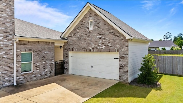 2409 Meadow Cove Rd, Auburn, AL 36832 - view of front of house with roof with shingles, an attached garage, brick siding, and driveway