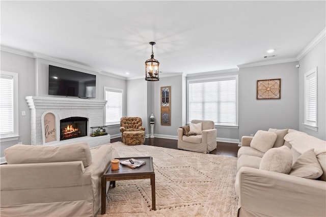 2409 Meadow Cove Rd, Auburn, AL 36832 - living area with ornamental molding, dark wood-type flooring, recessed lighting, and a brick fireplace