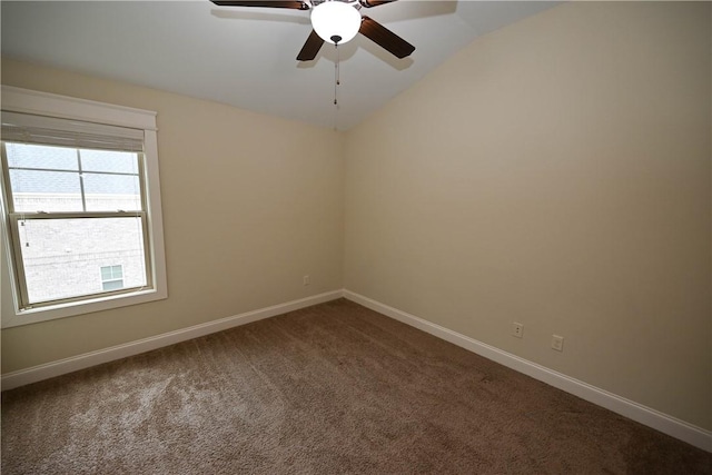 2228 Morgan Dr, Auburn, AL 36830 - unfurnished room with dark carpet, a ceiling fan, vaulted ceiling, and baseboards