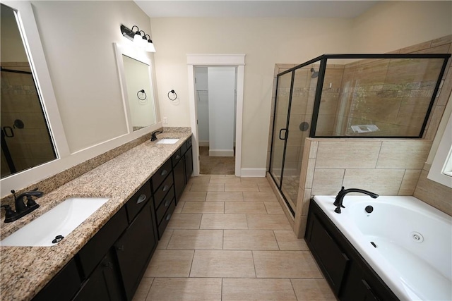 2228 Morgan Dr, Auburn, AL 36830 - full bath with a stall shower, a jetted tub, double vanity, tile patterned floors, and baseboards