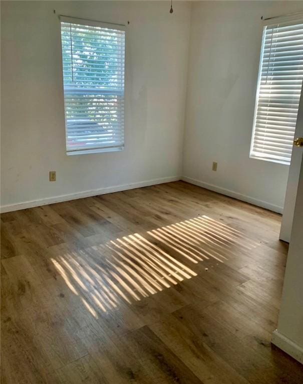 spare room featuring hardwood / wood-style floors