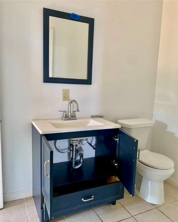 bathroom with tile patterned floors, sink, and toilet