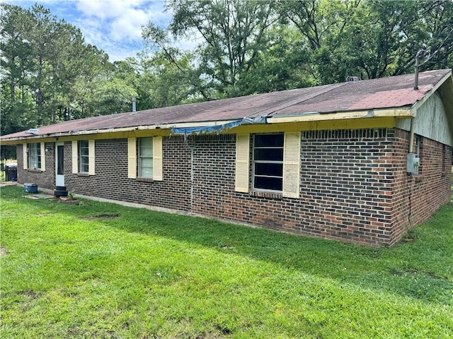 11485 US Highway 29, Tuskegee, AL 36803 - view of side of property with brick siding and a lawn